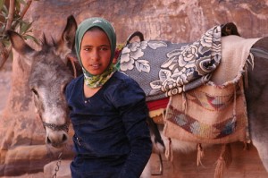 Girl in Jordan with donkey