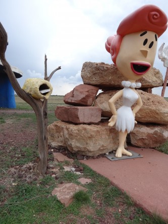 wilma outside of flintstone house at bedrock city in arizona