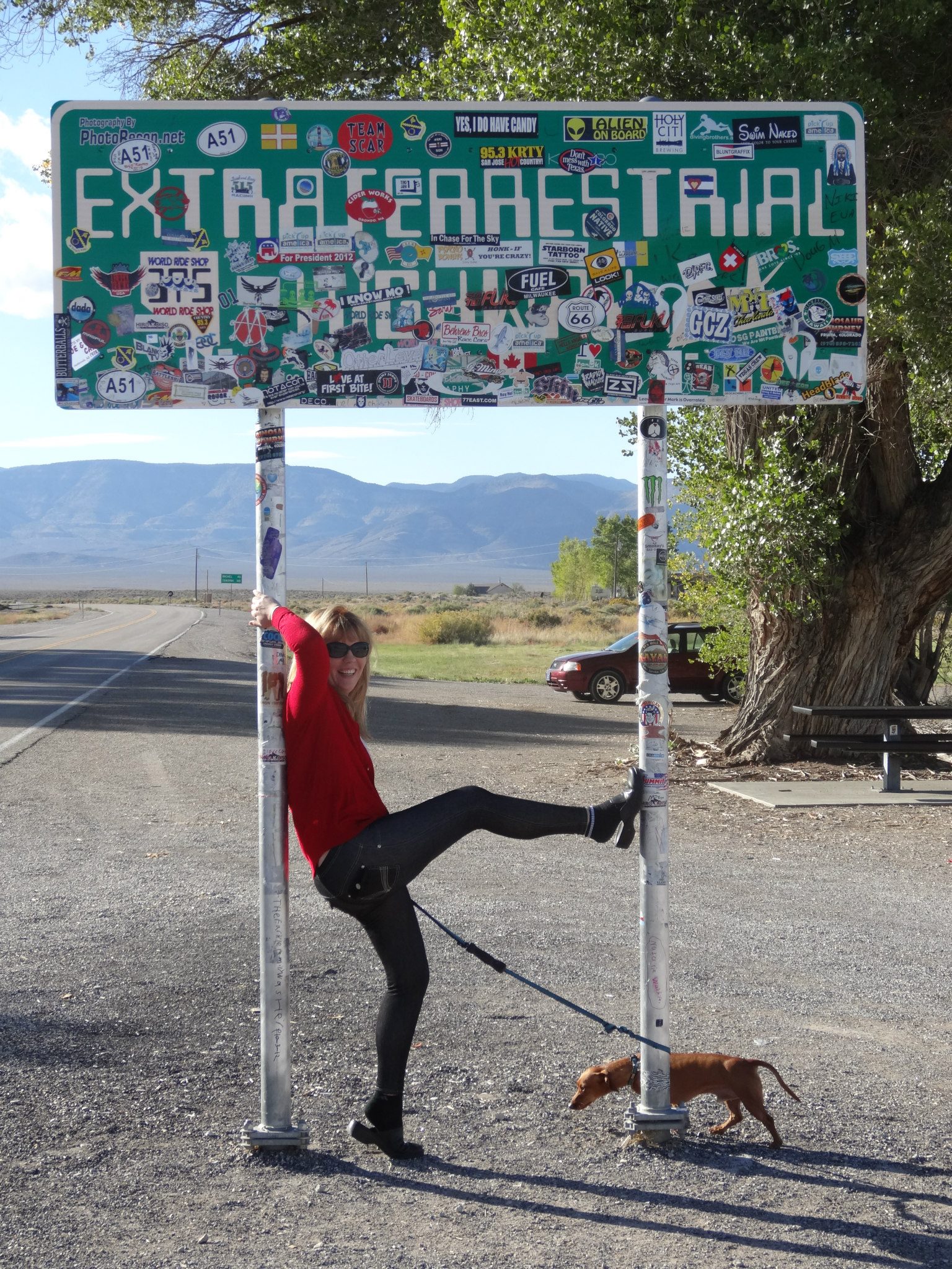 Reannon and dog posing infront of the extraterrestrial highway