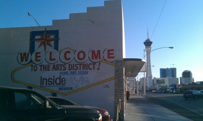 arts district sign and stratosphere hotel in the background