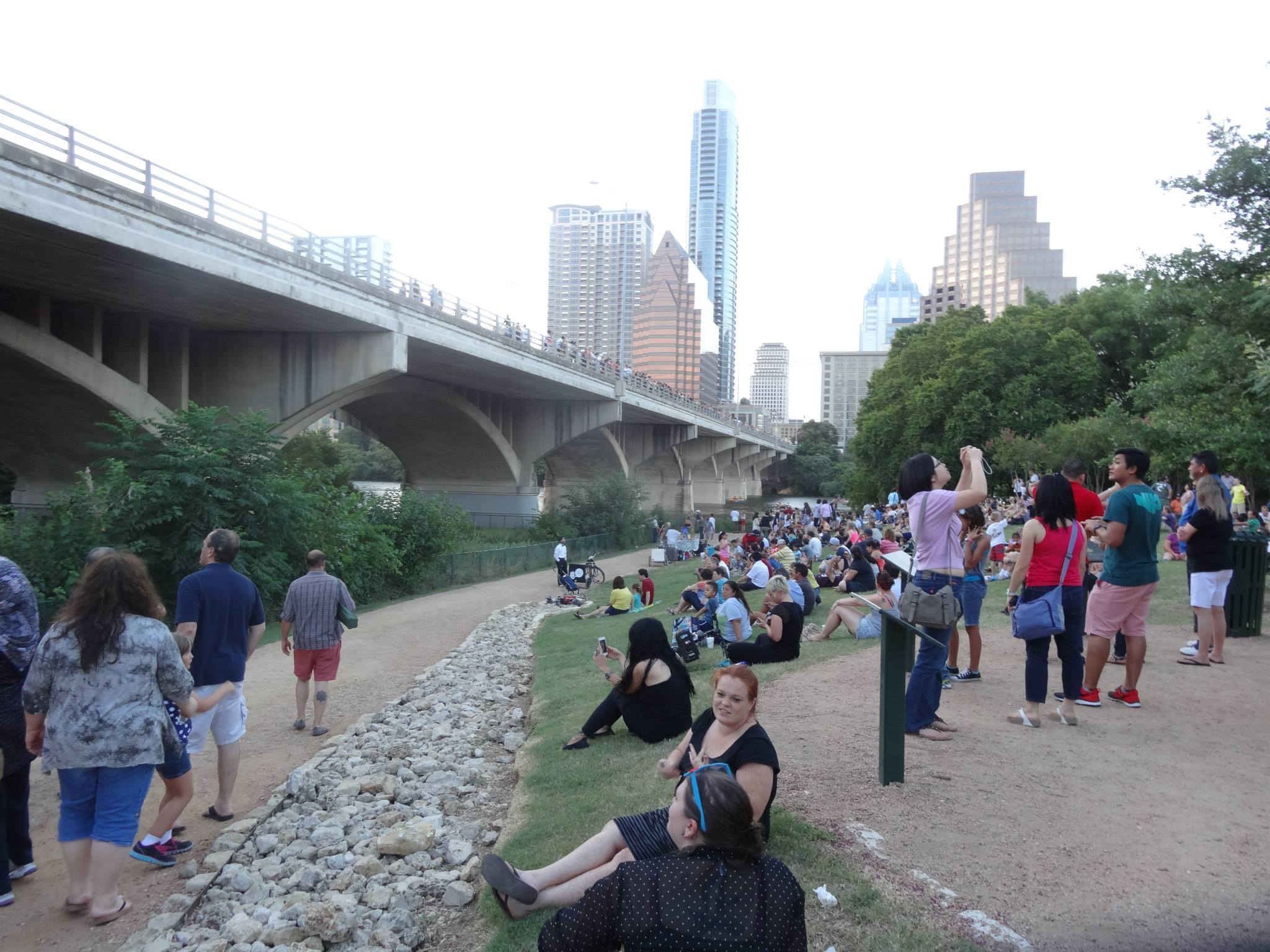 people gathered to watch the bats under the South Congress bridge in Austin Texas