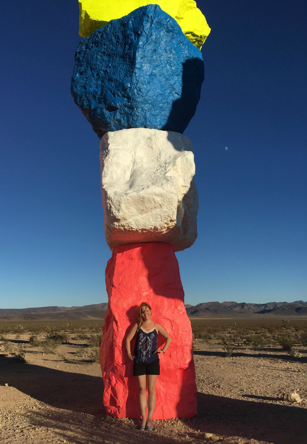 Standing in front of Seven Magic Mountains Rock Tower