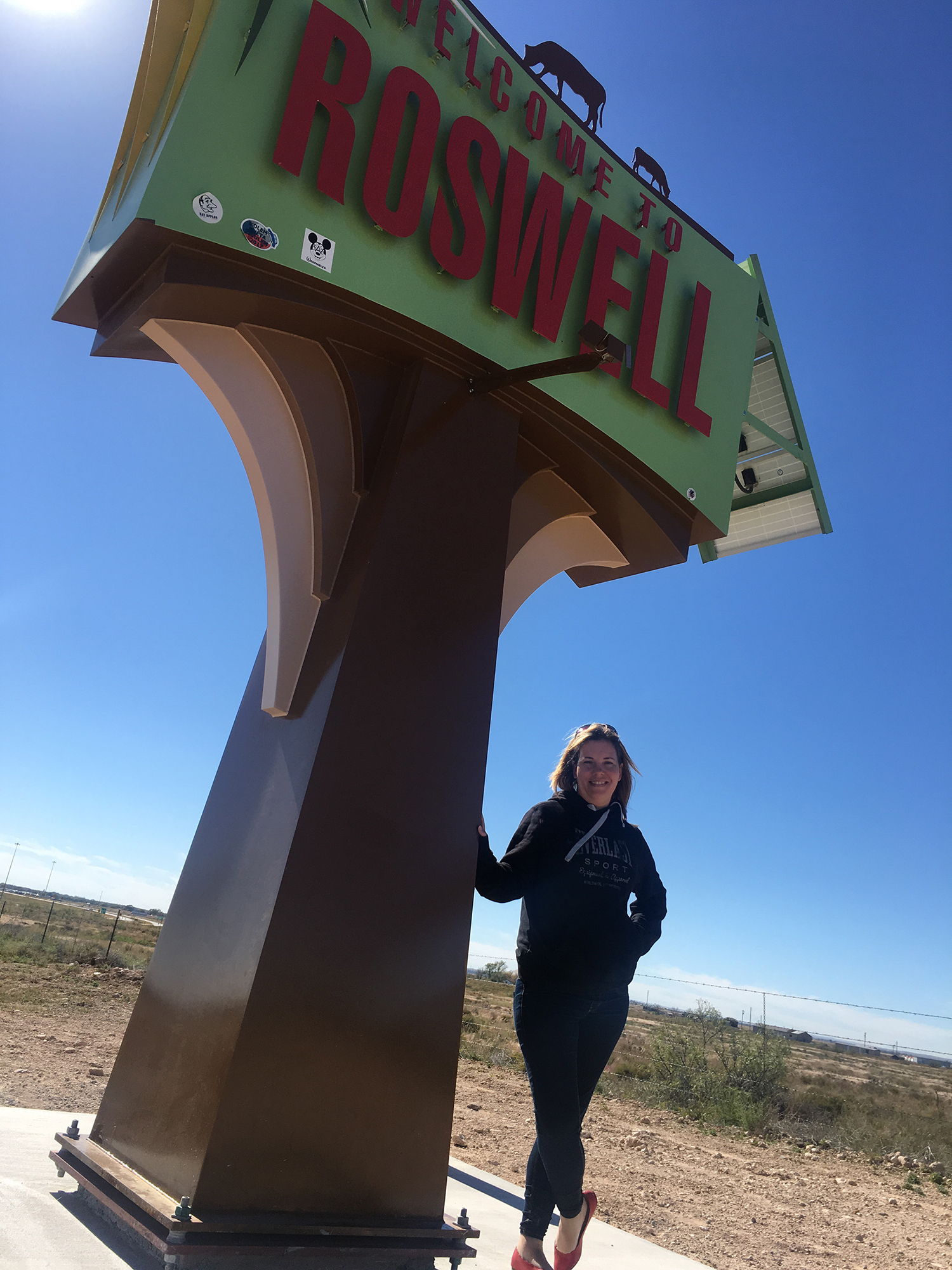 Standing in front of Roswell Sign