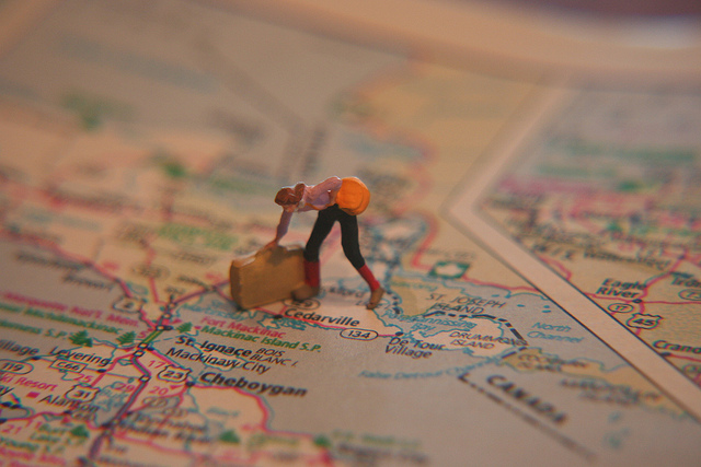 girl, suitcase and map